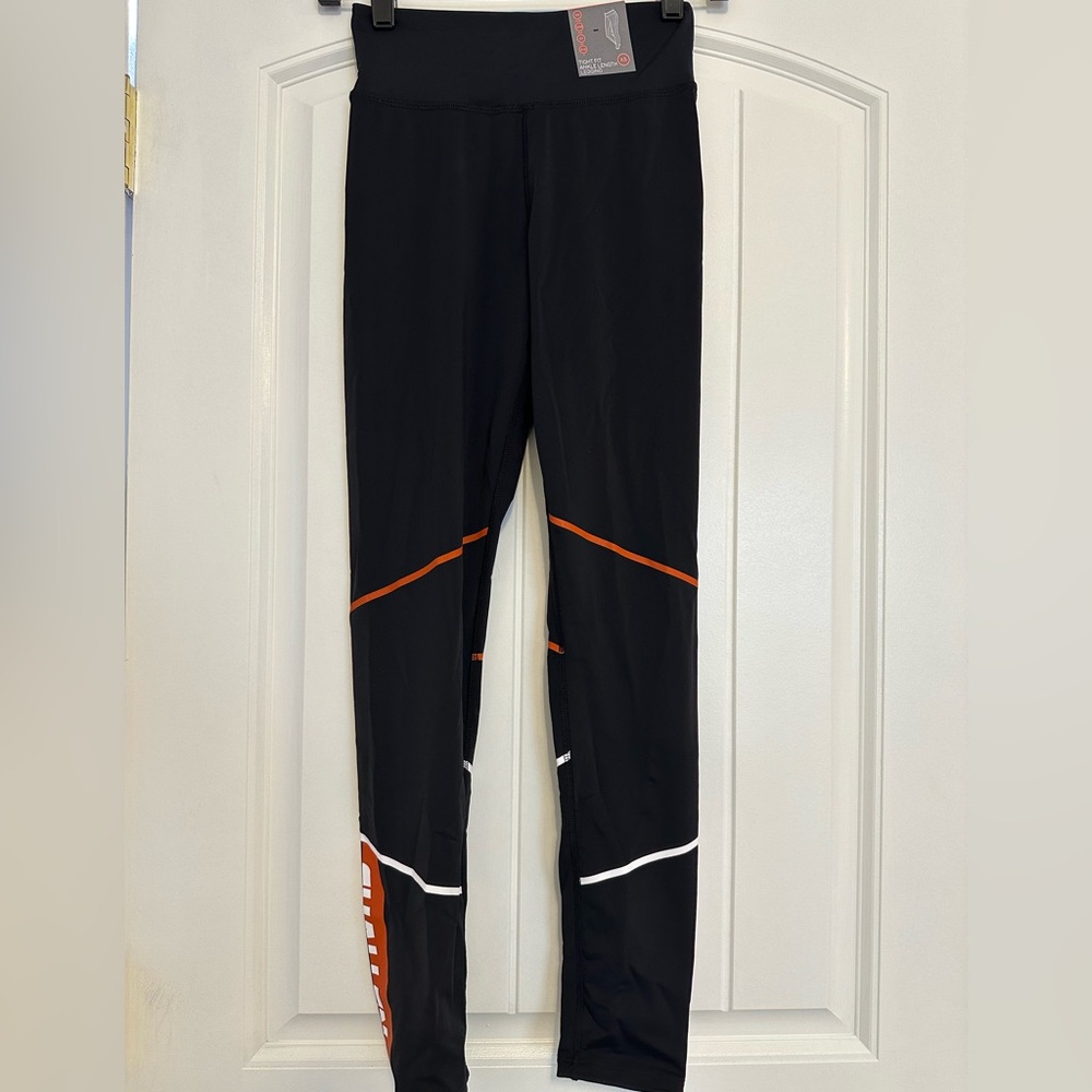PRIMARK black, white, and orange leggings